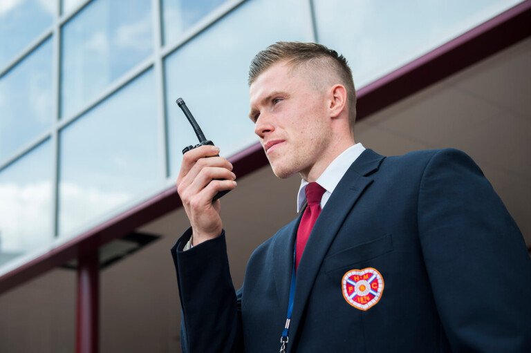 Security Guard on walkie talkie by Glasgow Photographers Blink Imaging Security Guard on walkie talkie by Glasgow Photographers Blink Imaging