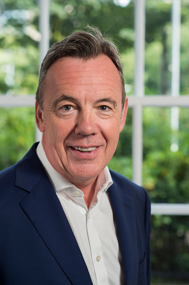 Corporate headshot using office window as background