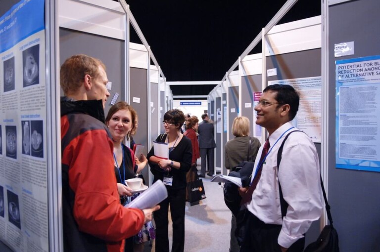 Delegates discussing medical papers at conference at Glasgow SECC Delegates discussing medical papers at conference at Glasgow SECC