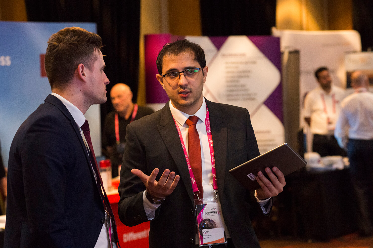 We take lots of candid shots during the conference or event such as this one of some exhibitors.