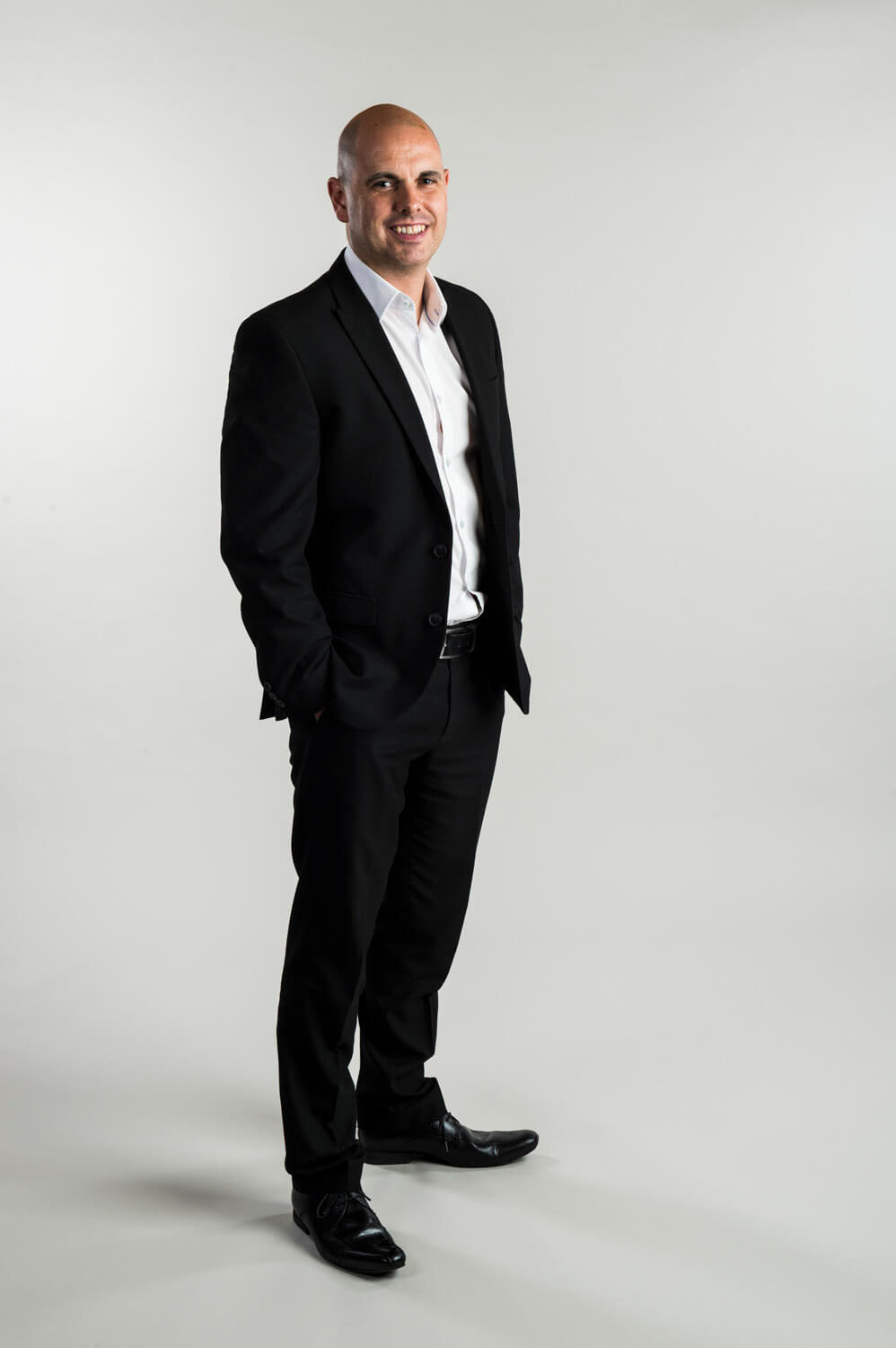 We had to set up a full size studio background and lighting at the client's premises in order to take these shots.