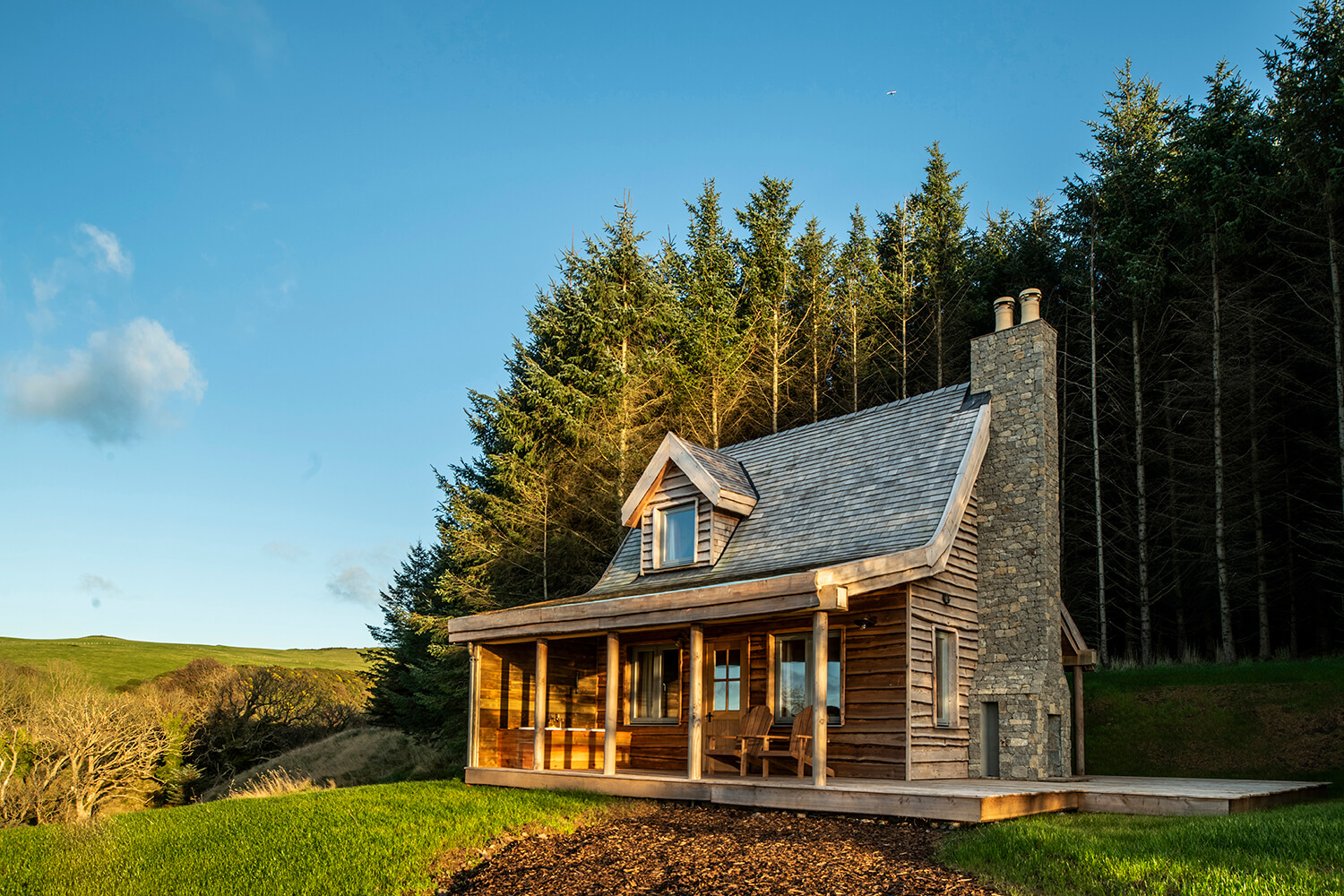 Exterior of woodland cabin by Glasgow architectural photographers Blink Imaging.