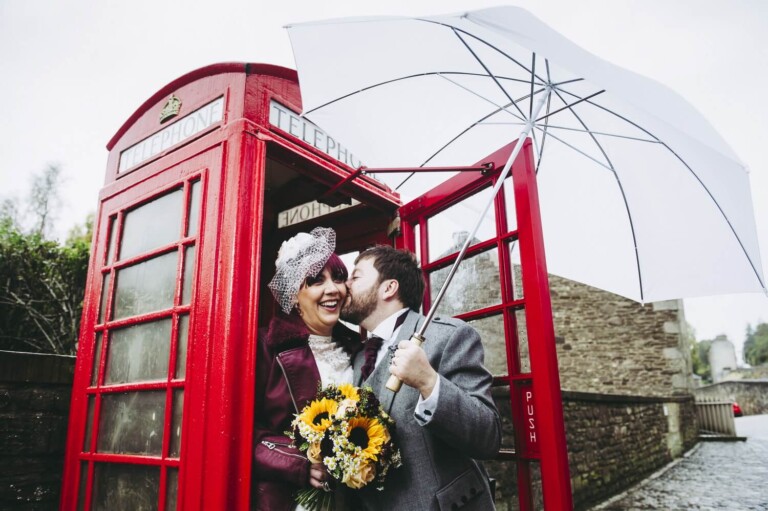 Bride and Groom in telephone box at New Lanark by Glasgow Wedding Photographer Richard Campbell