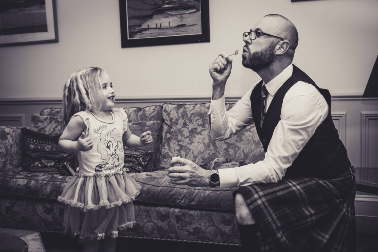Groom blowing bubbles by Glasgow wedding photographers Richard Campbell Photography