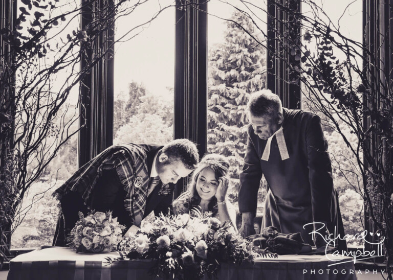 Signing the register at the Brig O Doon Hotel by Glasgow wedding photographer Richard Campbell