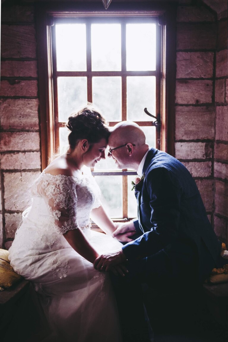 Bride and groom lit by natural window light by Glasgwo wedding photographers Richard Campbell Photography