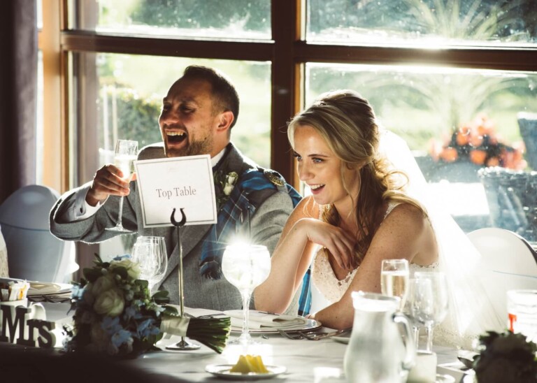 Bride and Groom at reception by Glasgow wedding photographer Richard Campbell