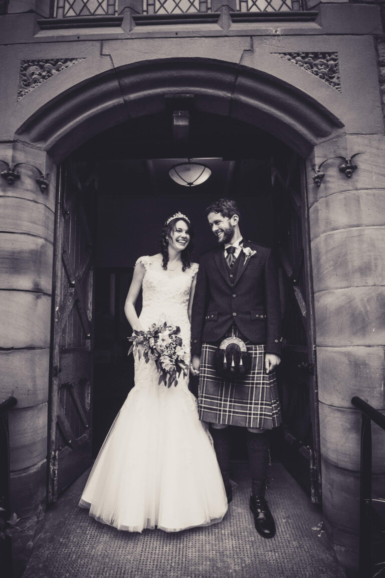 Bride and groom outside church in Glagsow by wedding photographer Richard Campbell